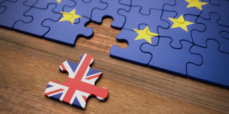 Image of a jigsaw with european flag and a union jack piece moved away to symbolise Brexit.